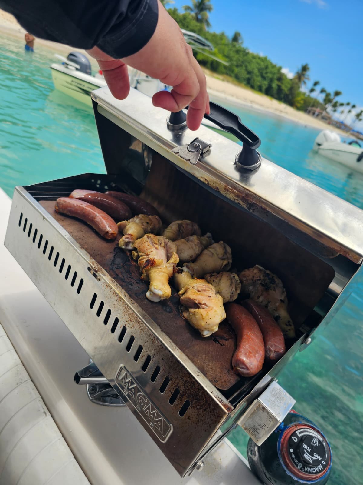 Onboard BBQ grill over crystal clear turquoise water on a Puerto Rico charter