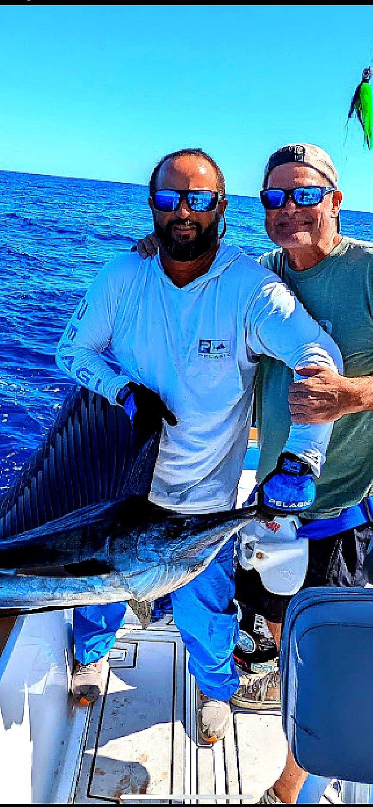 Angler with a blue marlin catch on a San Juan offshore fishing charter