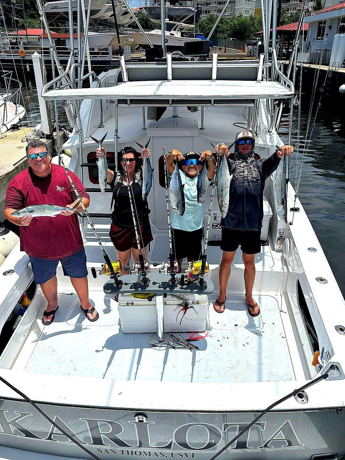 Guests with their catch aboard the Bertram 31 fishing charter in San Juan
