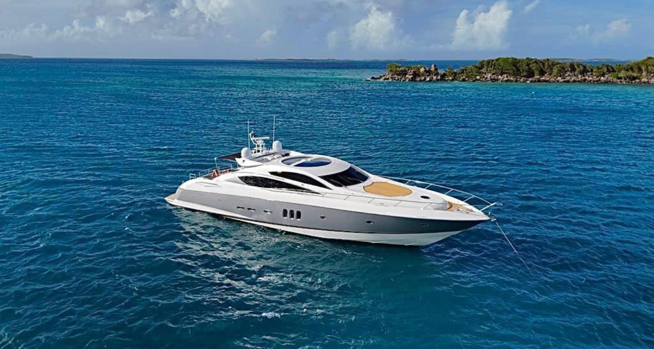 Sunseeker 82ft superyacht anchored in turquoise water