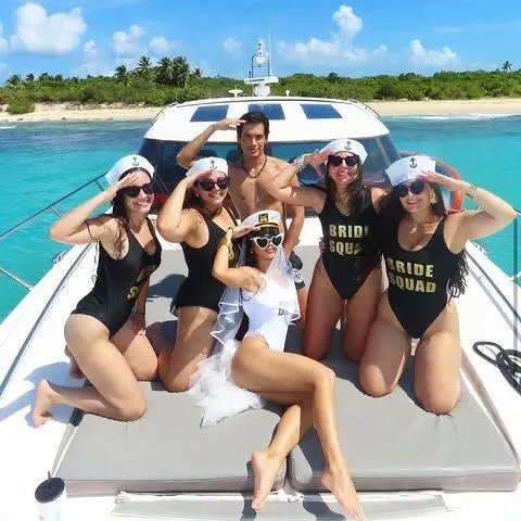 Bride Squad bachelorette group on the bow of a yacht in Puerto Rico