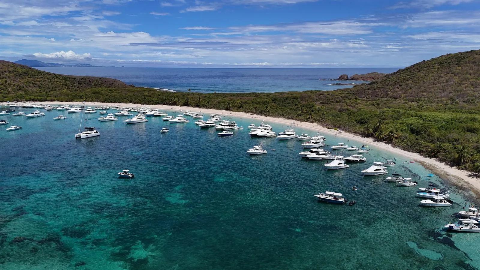 Aerial drone view of multiple private yachts anchored at Culebra Island Puerto Rico with turquoise water