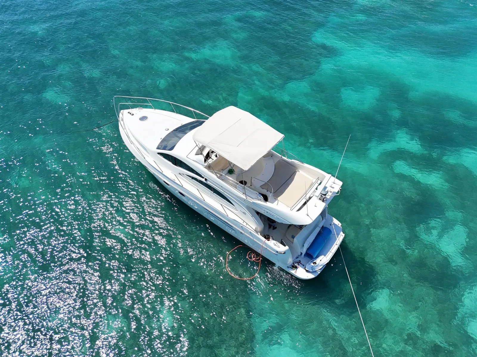 Top-down aerial of Azimut luxury yacht in turquoise Caribbean water