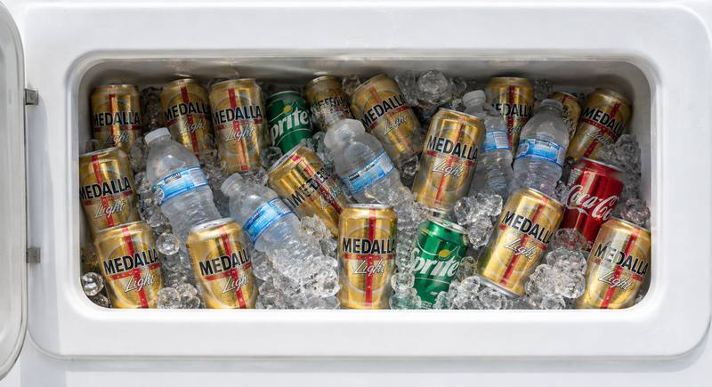 Onboard cooler packed with ice, cold Medalla Light beers, sodas and bottled water, all included on a Hydra Sport 25 private charter in Fajardo, Puerto Rico