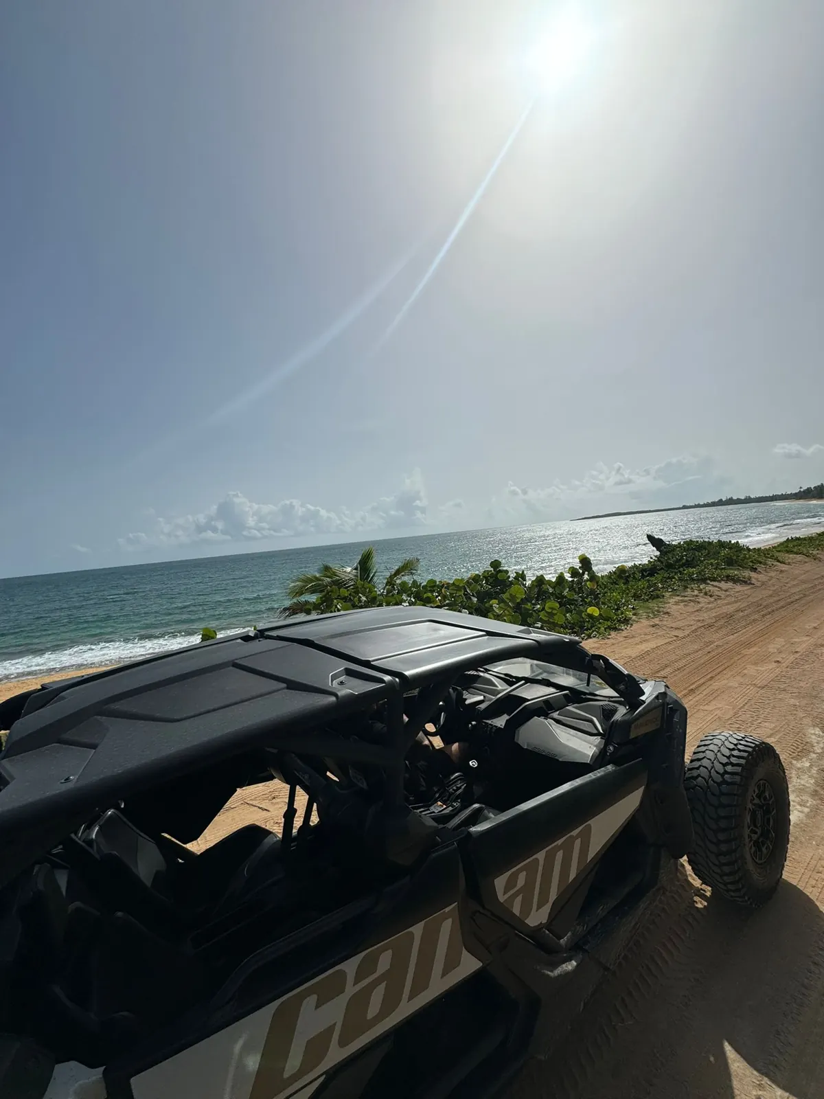 Can-Am Maverick parked on a beach trail with ocean views in Puerto Rico