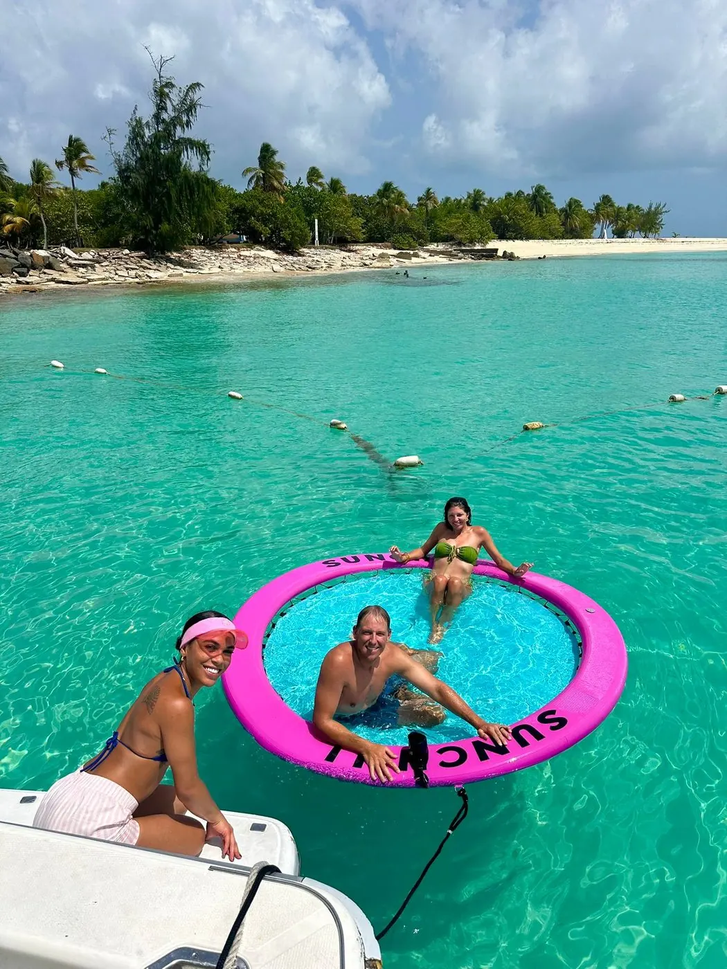 Guests on the floating mat beside the Lagoon 48