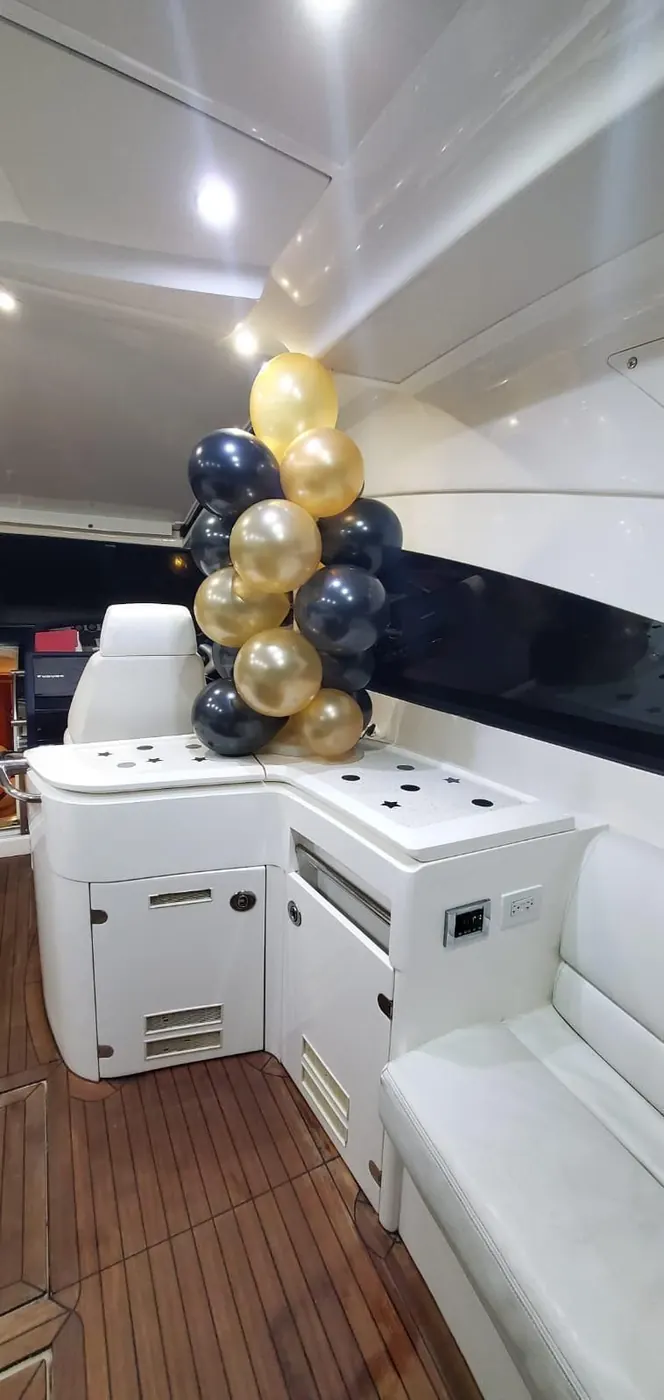 Black and gold balloon column onboard yacht