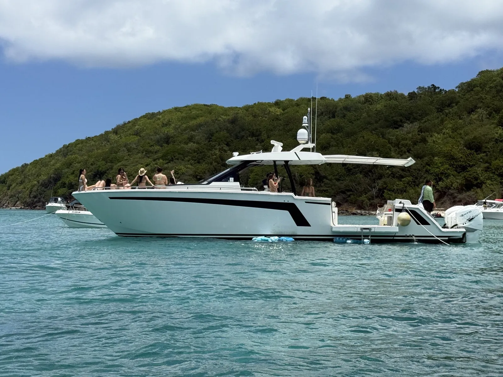 Ocean Alexander 48ft sport yacht with guests celebrating at Caribbean sandbar near Fajardo