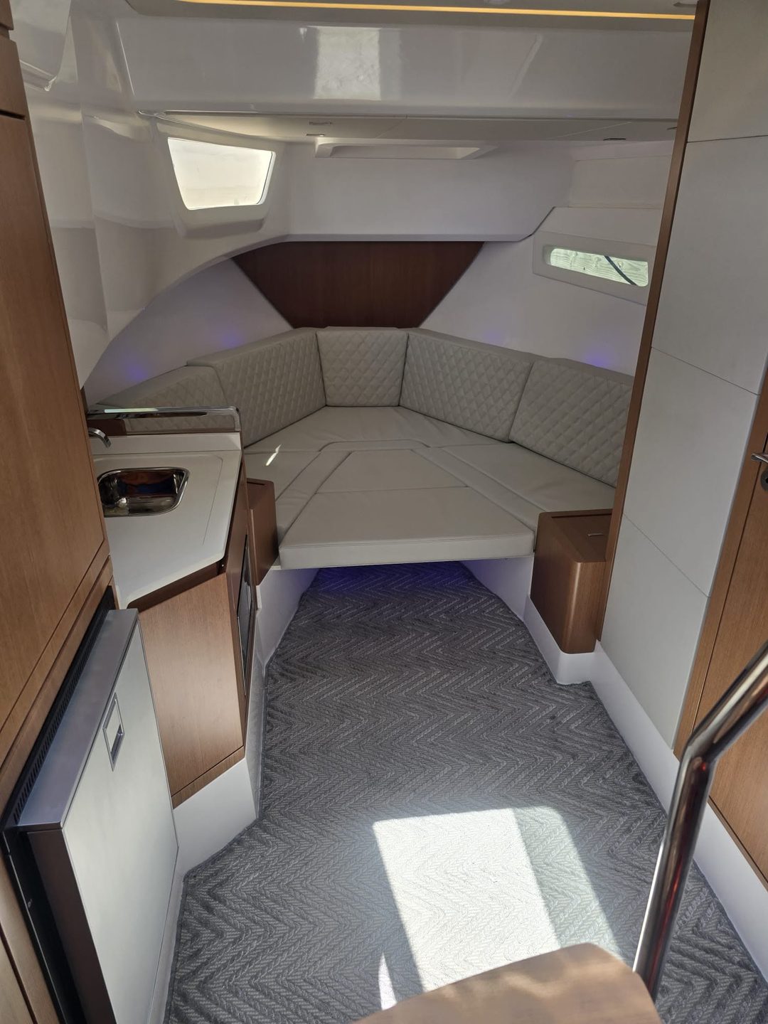 Forward cabin aboard the Schaefer with warm ambient light